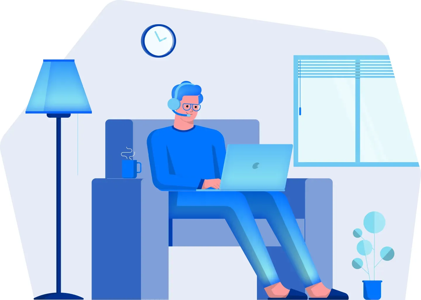 Remote worker using a laptop in an armchair at home